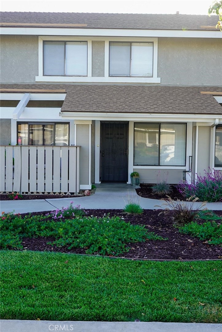 1193 E Foster Rd Unit C, Santa Maria, CA 93455 - view of front of home with stucco siding, covered porch, and a shingled roof