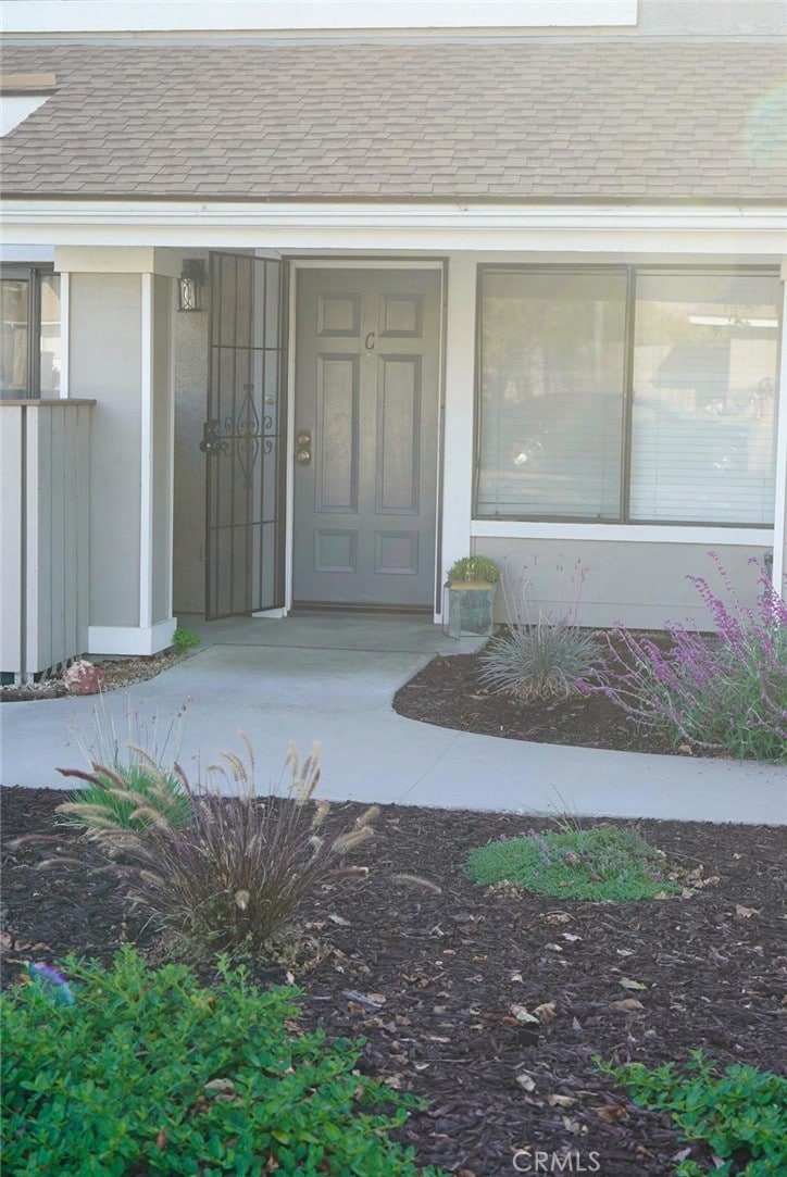 1193 E Foster Rd Unit C, Santa Maria, CA 93455 - view of exterior entry with roof with shingles