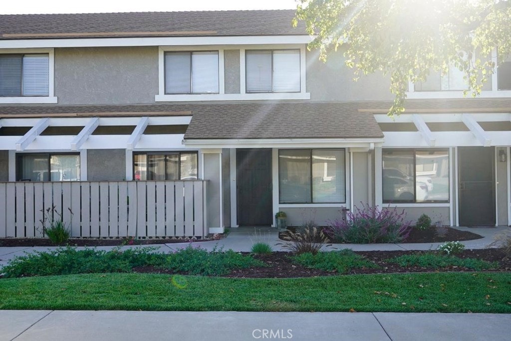 1193 E Foster Rd Unit C, Santa Maria, CA 93455 - view of front of house with stucco siding and a shingled roof
