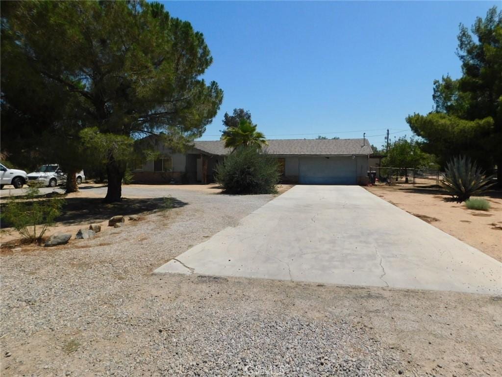 20049 Serrano Rd, Apple Valley, CA 92307 - view of front of house with a garage and concrete driveway