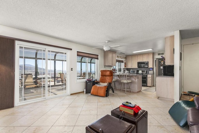 10323 Pine Grove St, Spring Valley, CA 91978 - living area featuring light tile patterned floors, a ceiling fan, and a textured ceiling