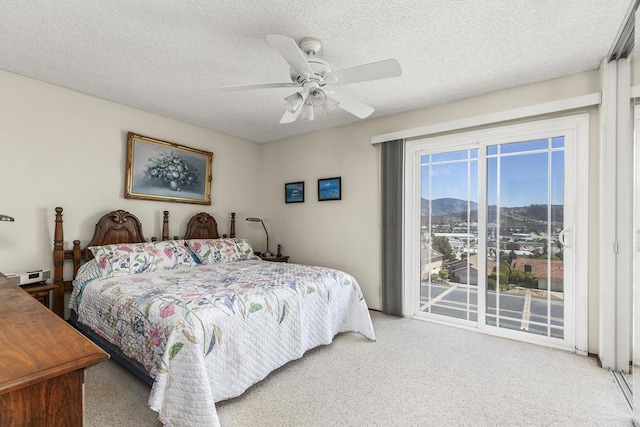 10323 Pine Grove St, Spring Valley, CA 91978 - bedroom with access to outside, carpet, a mountain view, a textured ceiling, and a ceiling fan