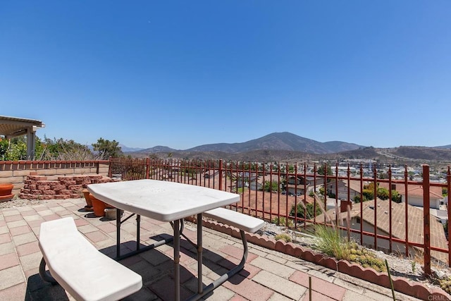 10323 Pine Grove St, Spring Valley, CA 91978 - view of patio featuring a mountain view and outdoor dining area