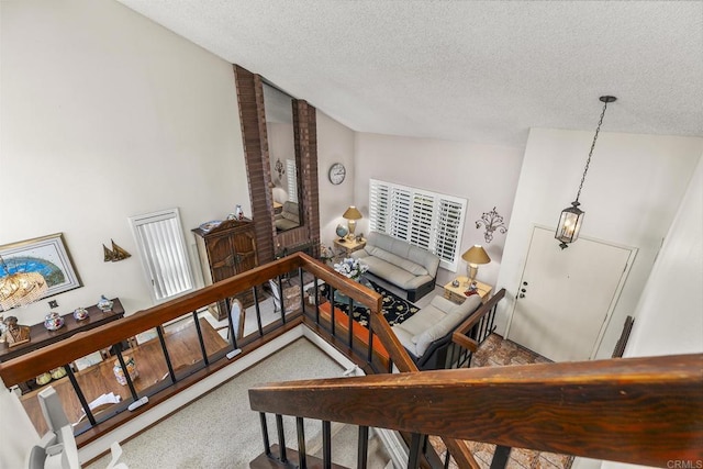 10323 Pine Grove St, Spring Valley, CA 91978 - stairs featuring a textured ceiling and vaulted ceiling