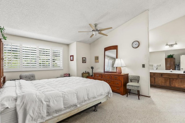 10323 Pine Grove St, Spring Valley, CA 91978 - carpeted bedroom with lofted ceiling, multiple windows, a textured ceiling, ensuite bath, and ceiling fan
