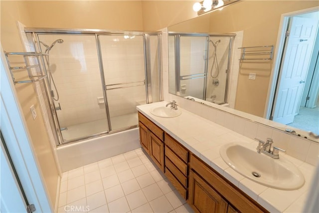 23169 Mulholland Dr Unit 3, Woodland Hills, CA 91364 - full bathroom featuring combined bath / shower with glass door, double vanity, and tile patterned floors