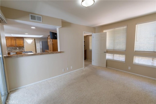 23169 Mulholland Dr Unit 3, Woodland Hills, CA 91364 - unfurnished living room featuring light colored carpet and recessed lighting