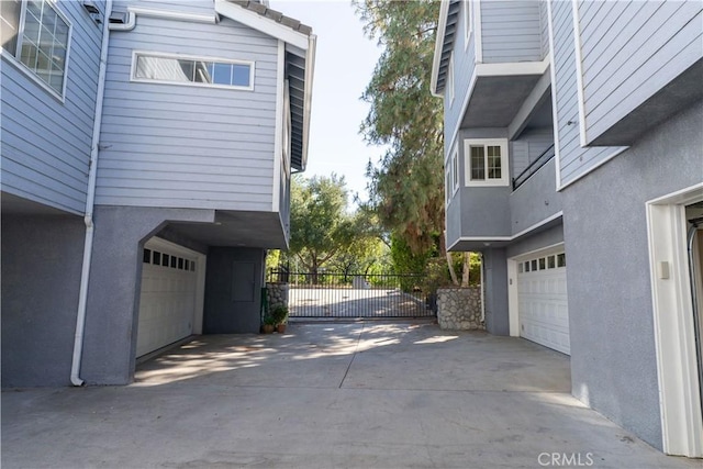 23169 Mulholland Dr Unit 3, Woodland Hills, CA 91364 - view of concrete driveway with a gated entry