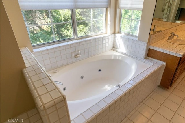 23169 Mulholland Dr Unit 3, Woodland Hills, CA 91364 - bathroom with healthy amount of natural light, a whirlpool tub, vanity, and tile patterned flooring