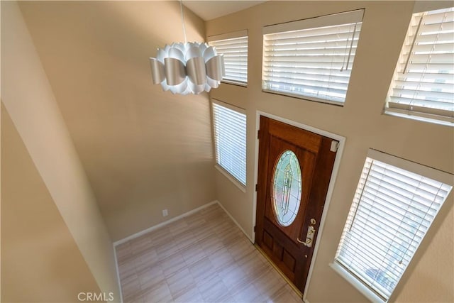 23169 Mulholland Dr Unit 3, Woodland Hills, CA 91364 - foyer entrance featuring a chandelier and a towering ceiling