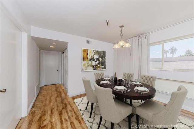 5473 Twin Lakes Dr, Cypress, CA 90630 - dining space with a chandelier and light wood-style flooring