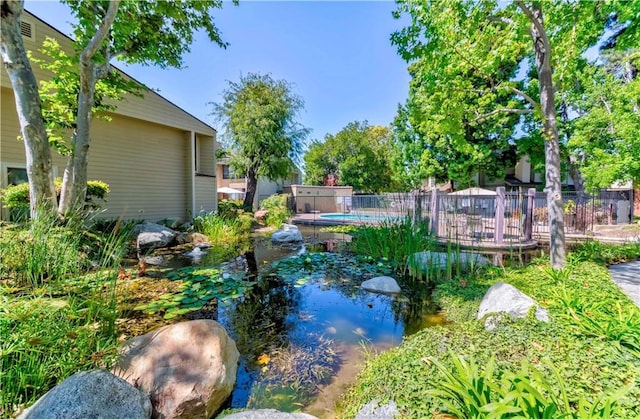 5473 Twin Lakes Dr, Cypress, CA 90630 - view of yard with a small pond
