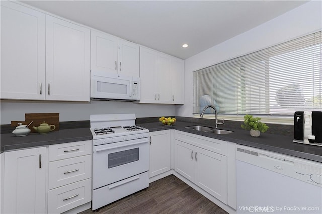 5473 Twin Lakes Dr, Cypress, CA 90630 - kitchen with white appliances, dark countertops, white cabinets, dark wood-type flooring, and recessed lighting