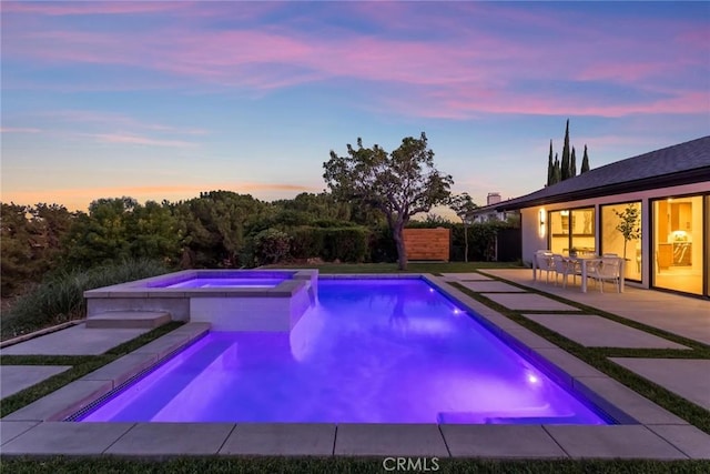 12350 Mclennan Ave, Granada Hills, CA 91344 - pool at dusk with a patio and a pool with connected hot tub