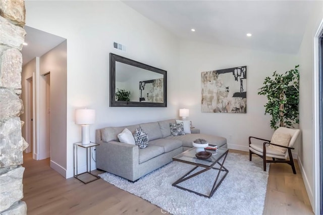 12350 Mclennan Ave, Granada Hills, CA 91344 - living room featuring wood finished floors, lofted ceiling, and recessed lighting