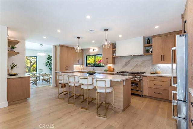12350 Mclennan Ave, Granada Hills, CA 91344 - kitchen featuring open shelves, high end appliances, a kitchen bar, plenty of natural light, and recessed lighting