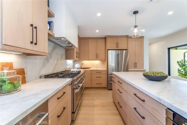 12350 Mclennan Ave, Granada Hills, CA 91344 - kitchen with light brown cabinetry, stainless steel appliances, recessed lighting, light wood finished floors, and decorative backsplash