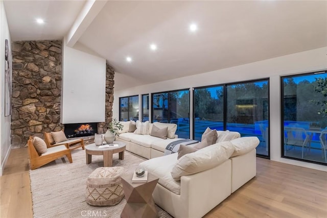 12350 Mclennan Ave, Granada Hills, CA 91344 - living area with light wood-style flooring and a fireplace