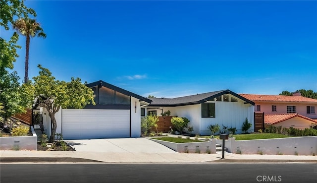 12350 Mclennan Ave, Granada Hills, CA 91344 - mid-century inspired home with a garage and concrete driveway