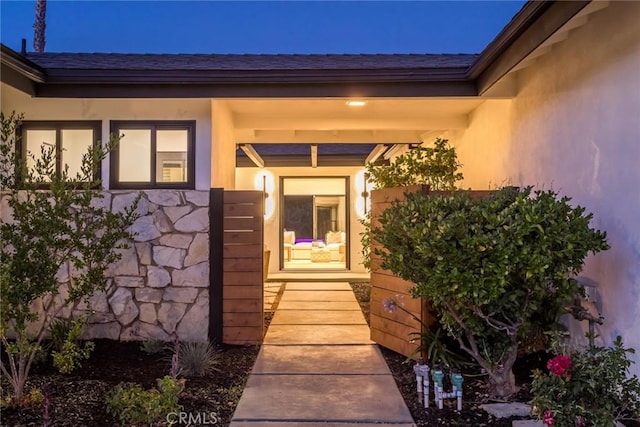 12350 Mclennan Ave, Granada Hills, CA 91344 - entrance to property featuring stucco siding, covered porch, and roof with shingles