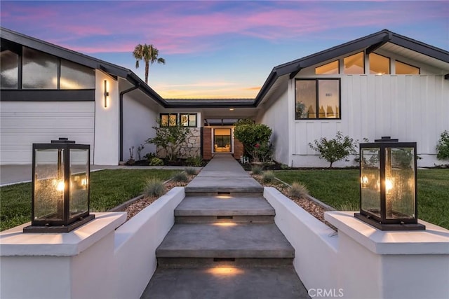 12350 Mclennan Ave, Granada Hills, CA 91344 - view of front facade featuring a front lawn and a garage