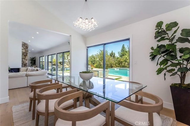 12350 Mclennan Ave, Granada Hills, CA 91344 - dining area with light wood-style flooring, vaulted ceiling, a chandelier, and recessed lighting