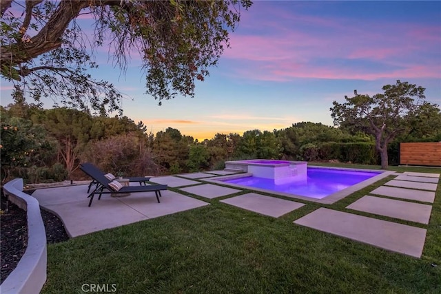 12350 Mclennan Ave, Granada Hills, CA 91344 - pool at dusk featuring a patio area, a yard, and a pool with connected hot tub