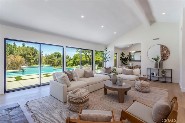 12350 Mclennan Ave, Granada Hills, CA 91344 - living area featuring beamed ceiling, plenty of natural light, wood finished floors, high vaulted ceiling, and recessed lighting