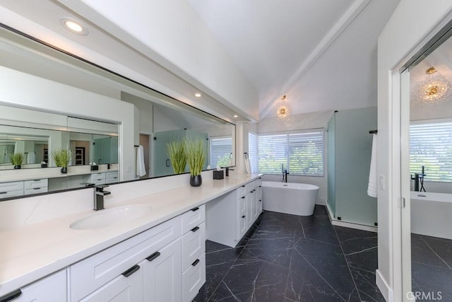 4330 E Cornwall Ave, Orange, CA 92867 - bathroom featuring double vanity, plenty of natural light, marble finish floors, a freestanding tub, and recessed lighting