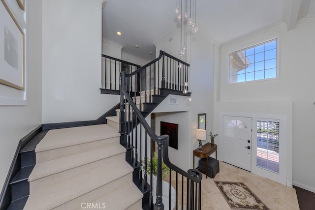 4330 E Cornwall Ave, Orange, CA 92867 - foyer featuring healthy amount of natural light, stairs, and ornamental molding