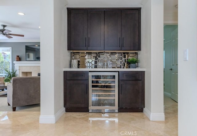 4330 E Cornwall Ave, Orange, CA 92867 - indoor dry bar with wine cooler, ornamental molding, ceiling fan, decorative backsplash, and recessed lighting