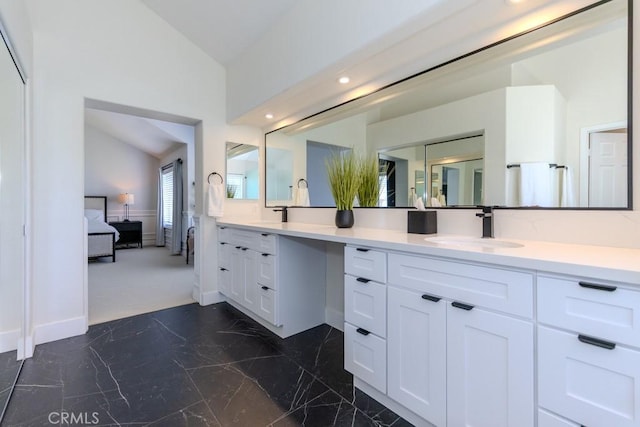 4330 E Cornwall Ave, Orange, CA 92867 - ensuite bathroom featuring vaulted ceiling, double vanity, marble finish floors, and recessed lighting