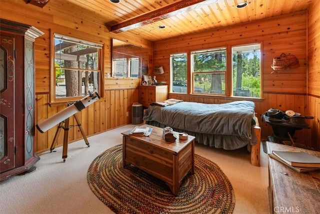 115 Lagunita Ln, Big Bear Lake, CA 92315 - bedroom featuring multiple windows, carpet flooring, wooden walls, and a wood ceiling with exposed beams