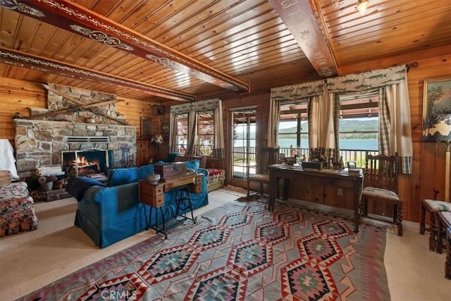 115 Lagunita Ln, Big Bear Lake, CA 92315 - living area featuring a wooden ceiling with exposed beams, wooden walls, a fireplace, and carpet floors