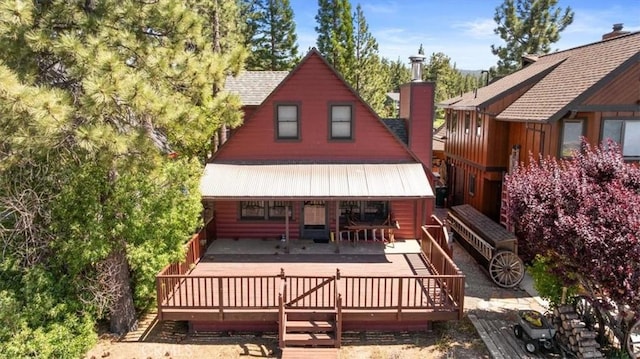 115 Lagunita Ln, Big Bear Lake, CA 92315 - back of property featuring a chimney and a wooden deck