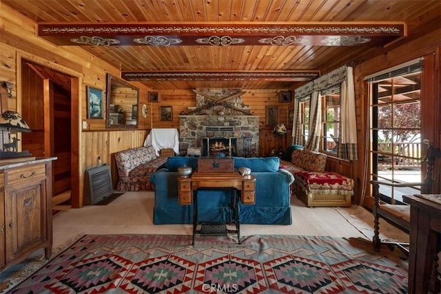 115 Lagunita Ln, Big Bear Lake, CA 92315 - living room featuring wood walls, a wooden ceiling with exposed beams, and a stone fireplace