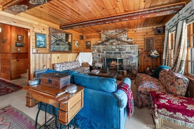 115 Lagunita Ln, Big Bear Lake, CA 92315 - carpeted living area featuring a wood ceiling with exposed beams, wood walls, and a stone fireplace