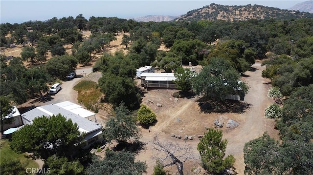 38150 Sumac Ln, Squaw Valley, CA 93675 - aerial view of property's location with a mountain backdrop and a heavily wooded area