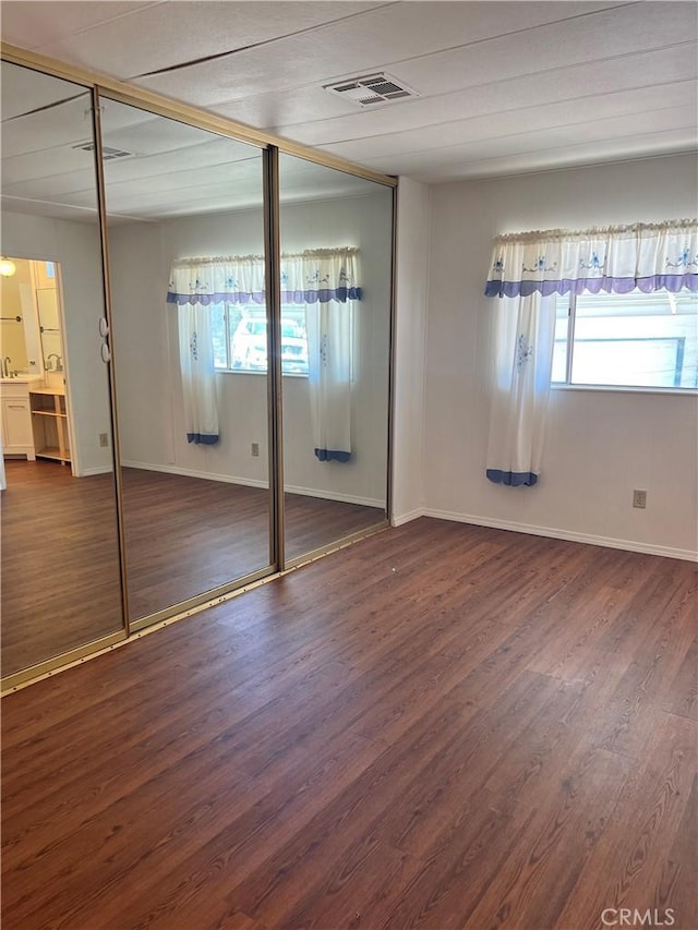 38150 Sumac Ln, Squaw Valley, CA 93675 - unfurnished bedroom with multiple windows and wood finished floors