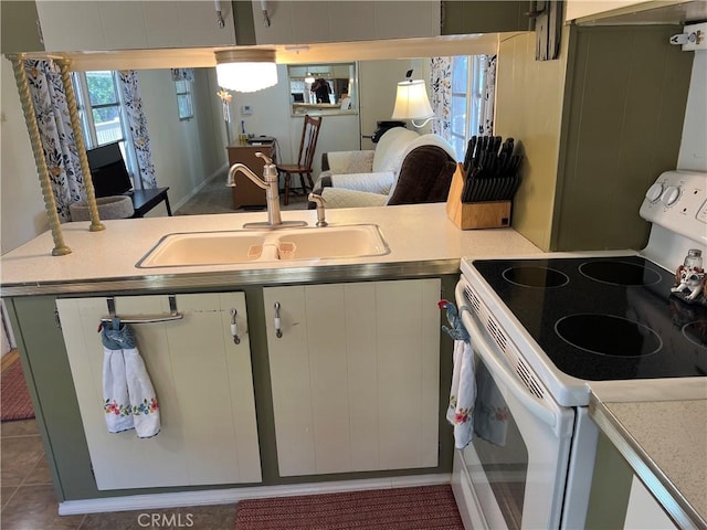 38150 Sumac Ln, Squaw Valley, CA 93675 - kitchen with white electric stove, light countertops, and white cabinets