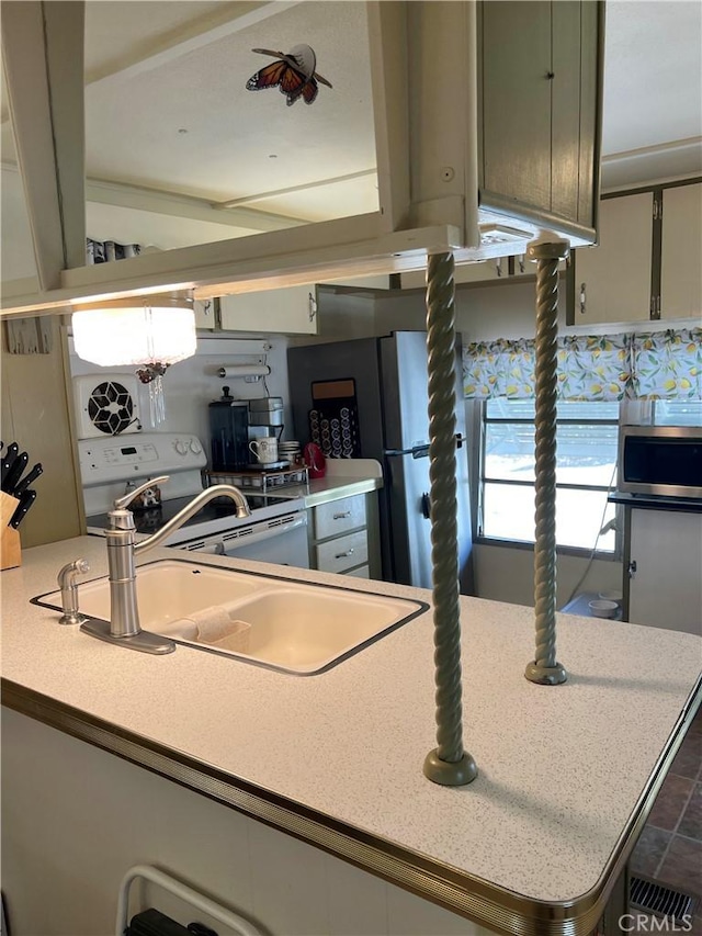 38150 Sumac Ln, Squaw Valley, CA 93675 - kitchen featuring stainless steel microwave, light countertops, white range with electric stovetop, and freestanding refrigerator