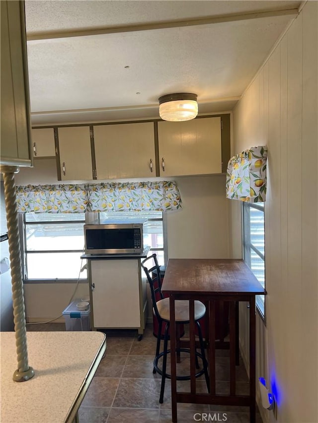 38150 Sumac Ln, Squaw Valley, CA 93675 - kitchen featuring stainless steel microwave, light countertops, and dark stone finish flooring
