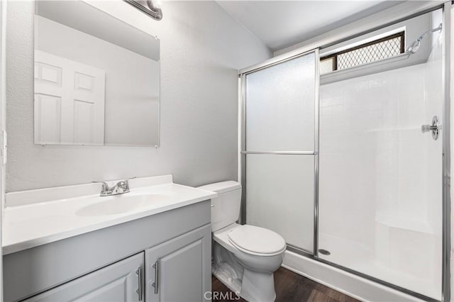 37632 15th St E, Palmdale, CA 93550 - bathroom with a shower stall, vanity, and wood finished floors