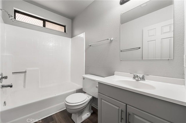 37632 15th St E, Palmdale, CA 93550 - bathroom with wood finished floors, vanity,  shower combination, and a textured wall
