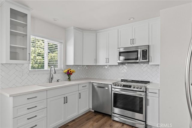 242 N 10th St Unit 242, Grover Beach, CA 93433 - kitchen with appliances with stainless steel finishes, white cabinetry, light countertops, and dark wood-style flooring