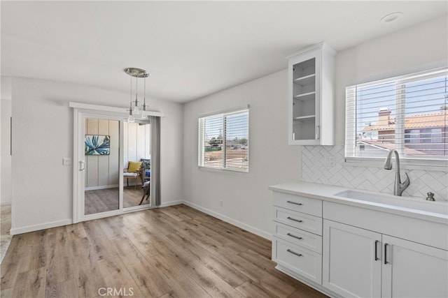 242 N 10th St Unit 242, Grover Beach, CA 93433 - unfurnished dining area featuring a sink and light wood-style floors