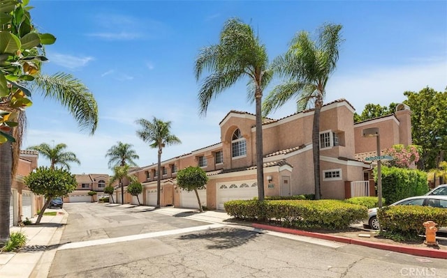 12152 Napoli Dr, Cerritos, CA 90703 - view of asphalt road with curbs and a residential view