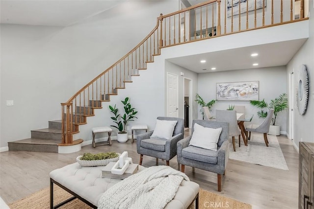 12152 Napoli Dr, Cerritos, CA 90703 - living area featuring stairway, wood finished floors, recessed lighting, and a high ceiling