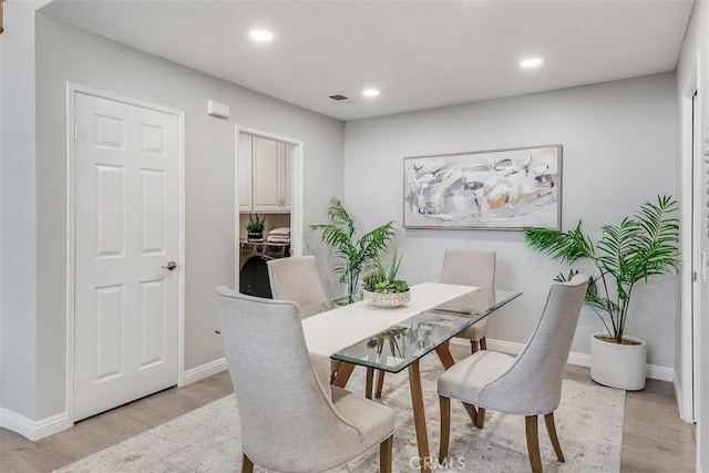 12152 Napoli Dr, Cerritos, CA 90703 - dining area featuring light wood-style floors, recessed lighting, and washing machine and dryer