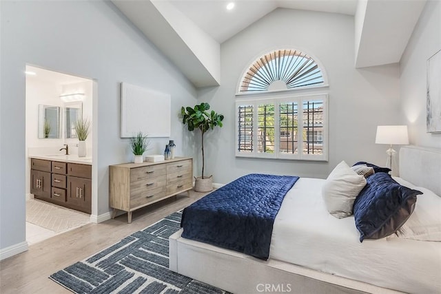 12152 Napoli Dr, Cerritos, CA 90703 - bedroom with light wood-type flooring, high vaulted ceiling, ensuite bath, and recessed lighting